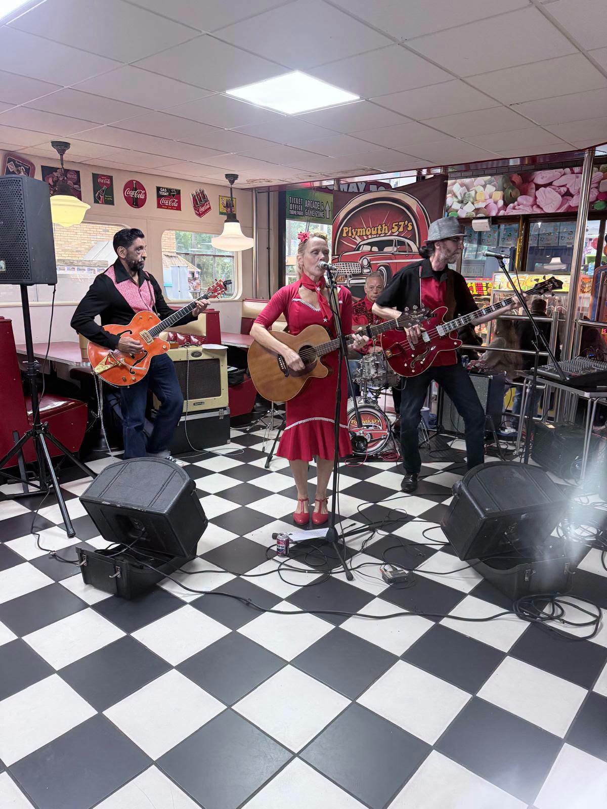 Lorna-Jane and the band playing live in a retro diner