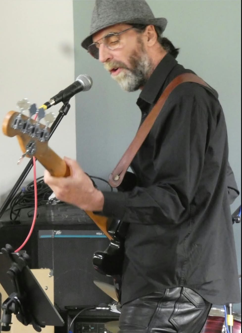 Mike performing with his bass guitar